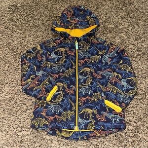 Cat & Jack Yellow Dinosaur Print Jacket writing on tag